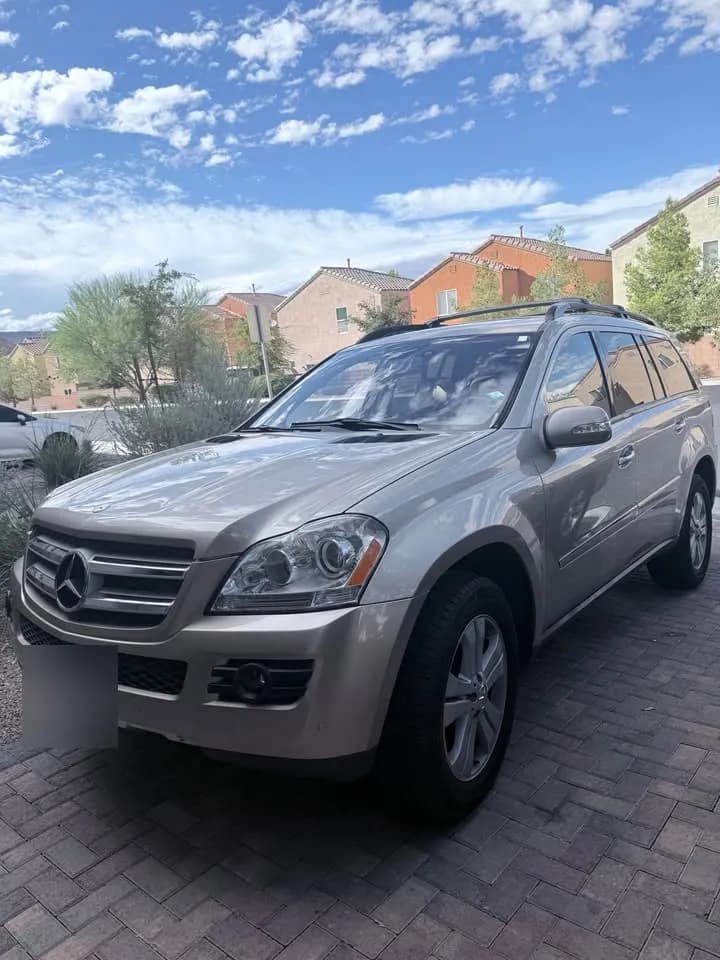 Silver Mercedes-Benz GL SUV bought by Cash For Cars Nevada, parked on a paver driveway