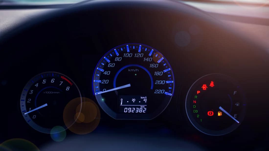A car dashboard with the odometer display: record the mileage on the Nevada title when you sell a car privately