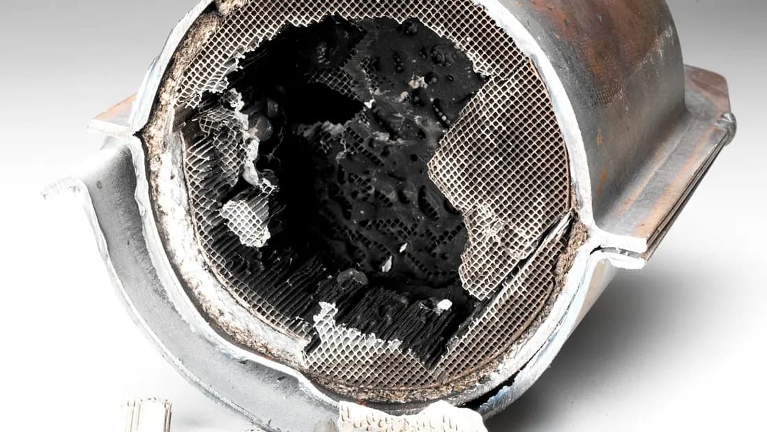 Why a catalytic converter changes what a junk car is worth A catalytic converter cut open to show the blackened honeycomb ceramic inside
